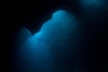 Light Seeps Into Dark Underwater Cavern in Palau Royalty Free Stock Photo