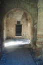 Light and shade at a walkway at the castle walls at the Alcazaba, Malaga, Spain. Royalty Free Stock Photo