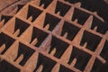 Light and shadow on backside surface of the old rusty manhole cover Royalty Free Stock Photo