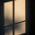 And shadow form a grid pattern on a textured beige wall resembling window Royalty Free Stock Photo