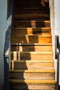 Light and shadow on an old wooden stairway Royalty Free Stock Photo