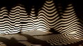 Light and shadow play creating intriguing abstract patterns. AI generated