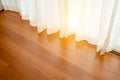 Close-up of draperies at a window. Shine light through the curtains of blinds closed the door. Royalty Free Stock Photo