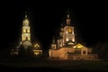 The light shines in the darkness. Kazan Cathedral and the bell tower of Diveevo Monastery at night