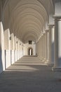 Light shines in white renaissance arcades and throws shades Royalty Free Stock Photo