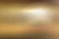 Light shining down on gold foil metallic wall with copy space, abstract texture background Royalty Free Stock Photo