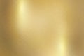 Light shining down on gold metal plate with copy space, abstract texture background Royalty Free Stock Photo