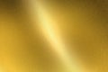 Light shining on gold metal sheet, abstract texture background Royalty Free Stock Photo