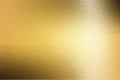 Light shining on gold painted metal plate with copy space, abstract texture background Royalty Free Stock Photo