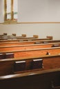 Light Shining in on Lutheran Church Pews with Hymnals Royalty Free Stock Photo