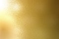 Light shining on rough gold metal sheet texture, abstract background Royalty Free Stock Photo
