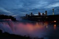 Light showcase lighting cascades of water Niagara Falls. Illuminated night view of Niagara Falls. Royalty Free Stock Photo