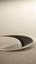 Close up of fine sand with a smooth curved indentation creating a circular shadow and subtle sparkling texture on a light Royalty Free Stock Photo