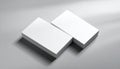 Two Stacks of Blank White Business Cards on a Light Gray Surface with Shadows Keywords: business card, blank, white Royalty Free Stock Photo