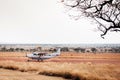 Light single engine Cessna plane running on airstrip in Serengeti Grumeti Reserve - Tanzania