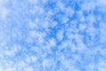 Light small cirrocumulus clouds on a sunny blue sky Royalty Free Stock Photo