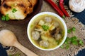 Light soup with dried mushrooms, meatballs and maccheroni in a white bowl. Royalty Free Stock Photo