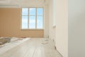 Light spacious room with unfinished laminate flooring Royalty Free Stock Photo