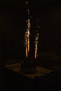 Sparks from the sparklers fountains wedding cake