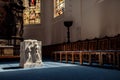 Light spots on the altar and the floor in church. Sunlight filtered through the stained glass window. Aged photo Royalty Free Stock Photo