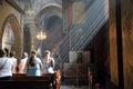 Light streams through the window onto worshippers during a service at the Armenian Cathedral in central Lviv, Ukraine