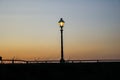 Street lamp over sunset Royalty Free Stock Photo