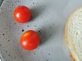 light summer breakfast tomatoes with bread on a plate Royalty Free Stock Photo