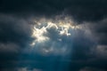 Light of sun from dark clouds. Royalty Free Stock Photo