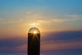 Light from the sun shining through the bulb with beautiful sunset sky background Royalty Free Stock Photo
