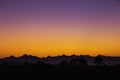 Light before sunrise and mountain shadows.