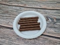 A light sweet chocolate snack in the form of a crunchy stick in Indonesia is called Astor