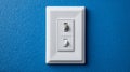 Light switch on a blue wall, modern home interior design. Royalty Free Stock Photo