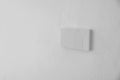 Light switch, Close-up White plastic mechanical switch mounted on a white wall Royalty Free Stock Photo