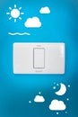 Light switch, day, night on a blue wall. Royalty Free Stock Photo