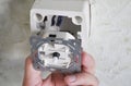 Light switch dimmer. Electrician installing and repair a dimmer switch in a wall socket