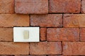 Light switch on red brick wall Royalty Free Stock Photo