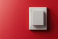 Light switch on vibrant red wall in modern setting Royalty Free Stock Photo