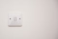 Light switch on a white wall Royalty Free Stock Photo