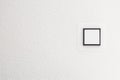 Light switch on white wall, detail shot Royalty Free Stock Photo