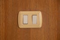 Light switch on a wooden wall close-up Royalty Free Stock Photo