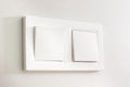 Light switches, white plastic mechanical switches mounted on white walls Royalty Free Stock Photo