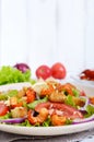 Light tasty salad with meat of a cancer, shrimps, lettuce, garlic croutons, tomatoes, red onion Royalty Free Stock Photo