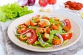 Light tasty salad with meat of a cancer, shrimps, lettuce, garlic croutons, tomatoes, red onions Royalty Free Stock Photo