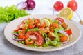 Light tasty salad with meat of a cancer, shrimps, lettuce, garlic croutons, tomatoes, red onions Royalty Free Stock Photo