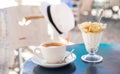 Light and tasty summer holidays breakfast cap of coffee cappuccino and yogurt with sliced banana, pear topped with honey in the