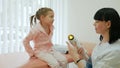 Light therapy, hospital treatment, child at doctor`s reception, physiotherapy in hospital, nurse makes light treatment