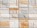 Light- Toned Stone Brick Wall with Subtle Orange Accents and Textured Finish pattern Royalty Free Stock Photo