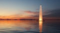 A light tower on the lake reflects off the rippling water