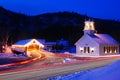 Light traffic goes through a small town decorated for the Christmas season Royalty Free Stock Photo