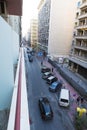 Light traffic and parked cars on a road